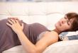 Why is it not recommended for pregnant women to sleep on their back?
